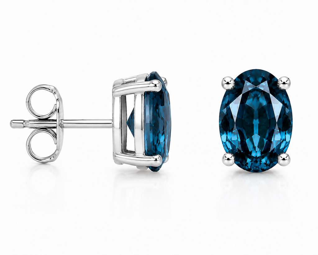 Natural 4x6mm oval London Blue Topaz solitaire stud earrings in 925 sterling silver with platinum plated finish