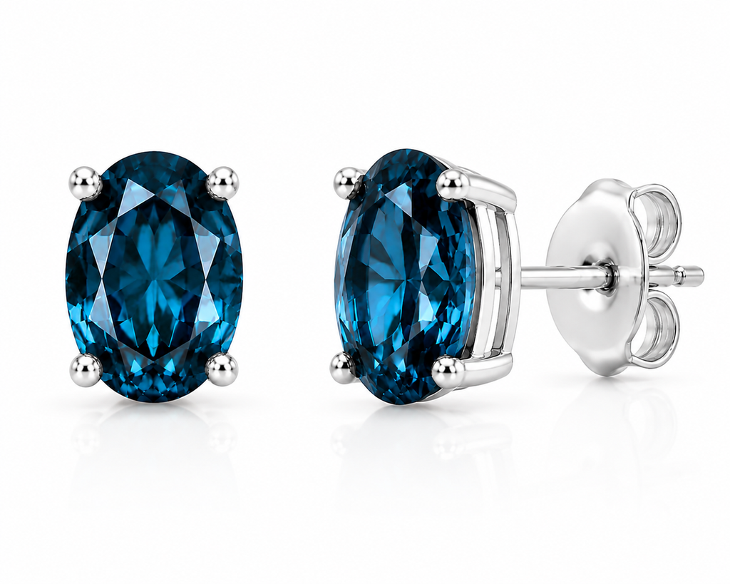 Natural 4x6mm oval London Blue Topaz solitaire stud earrings in 925 sterling silver with platinum plated finish