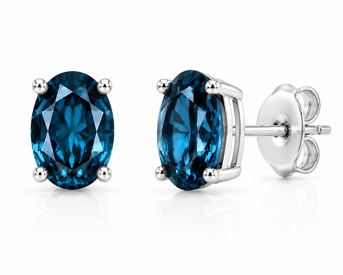 Natural 4x6mm oval London Blue Topaz solitaire stud earrings in 925 sterling silver with platinum plated finish