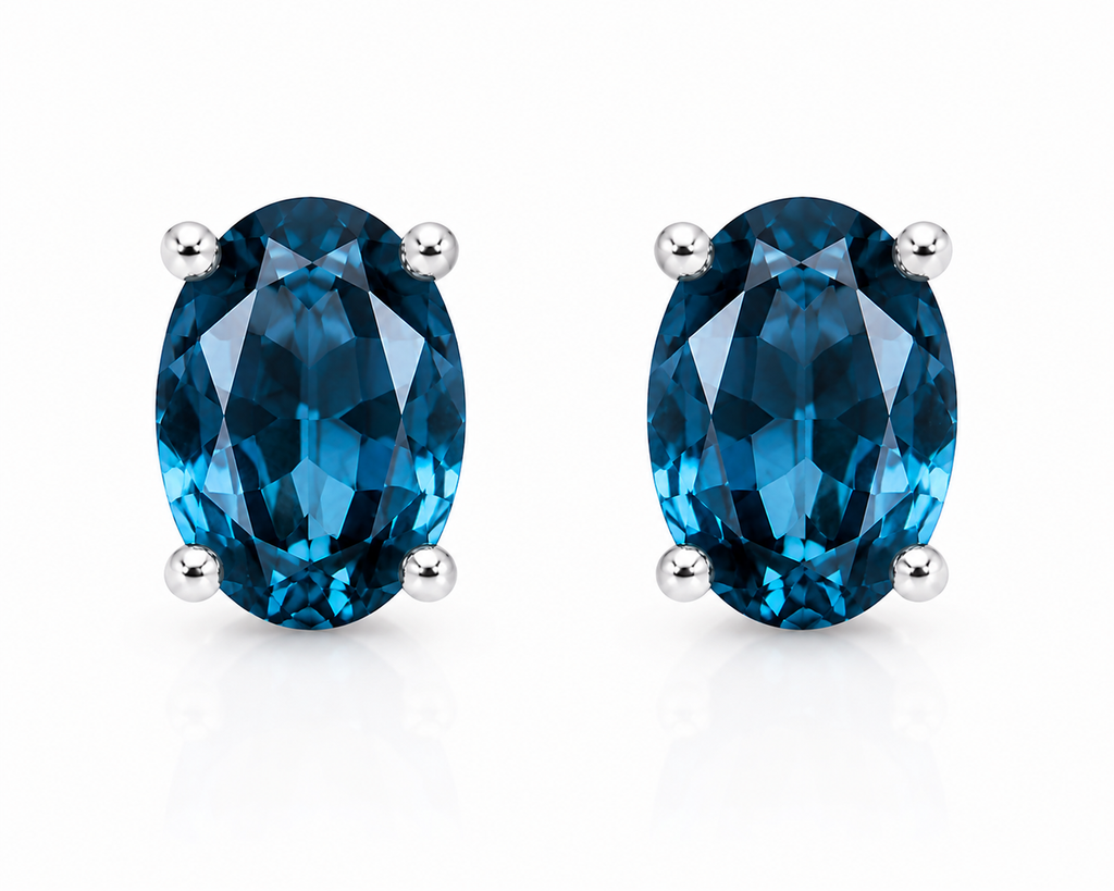 Natural 4x6mm oval London Blue Topaz solitaire stud earrings in 925 sterling silver with platinum plated finish