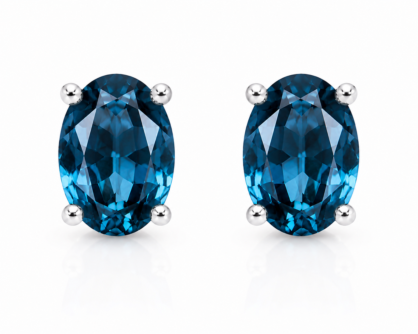 Natural 4x6mm oval London Blue Topaz solitaire stud earrings in 925 sterling silver with platinum plated finish