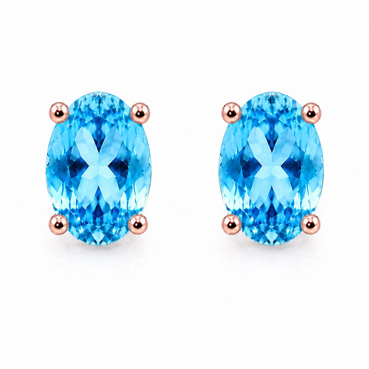 Front and side views of 4x6mm Swiss Blue Topaz solitaire earrings showing the open basket setting, post, and butterfly closure