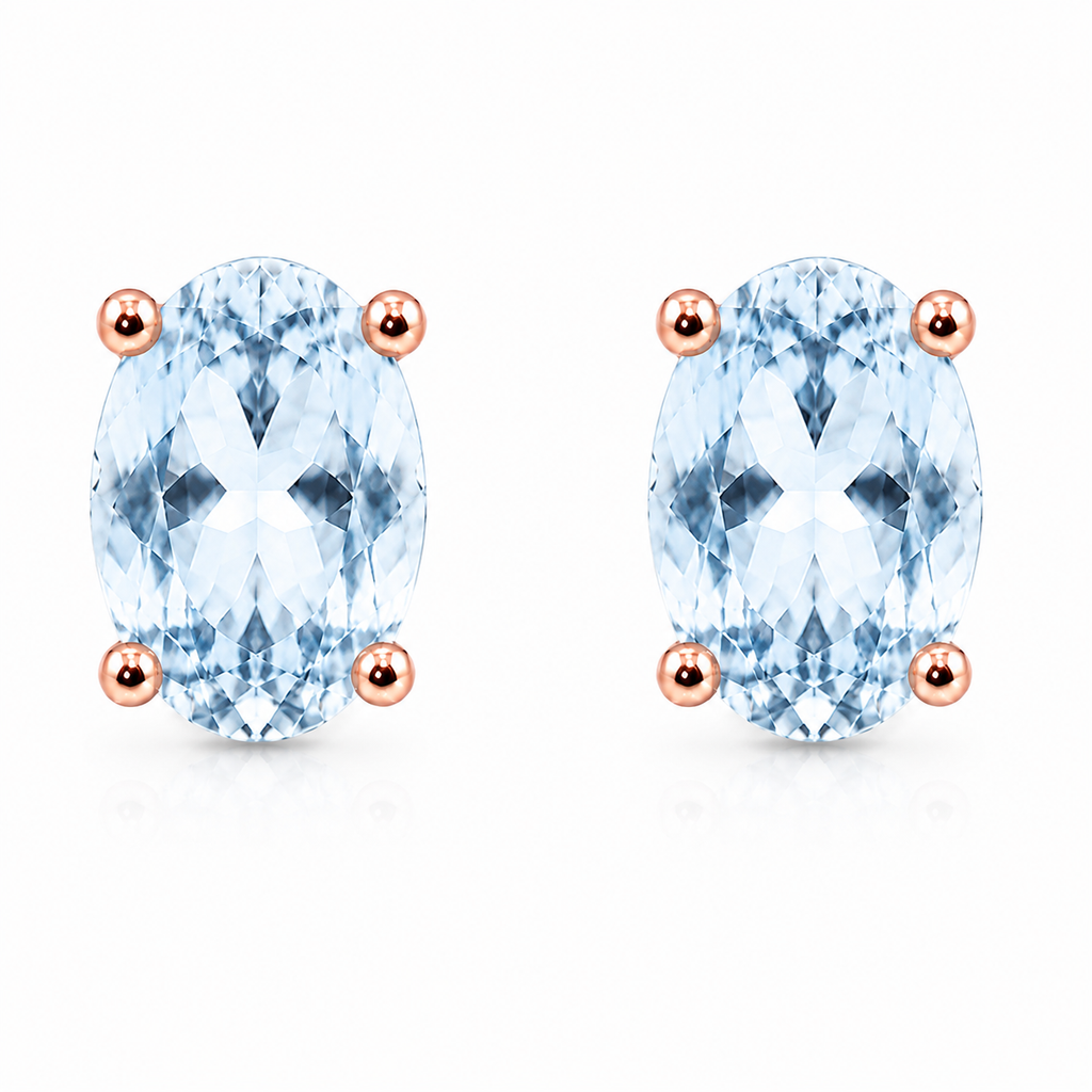 Natural 4x6mm oval Sky Blue Topaz solitaire stud earrings in Rose Gold Plated 925 sterling silver on a white background