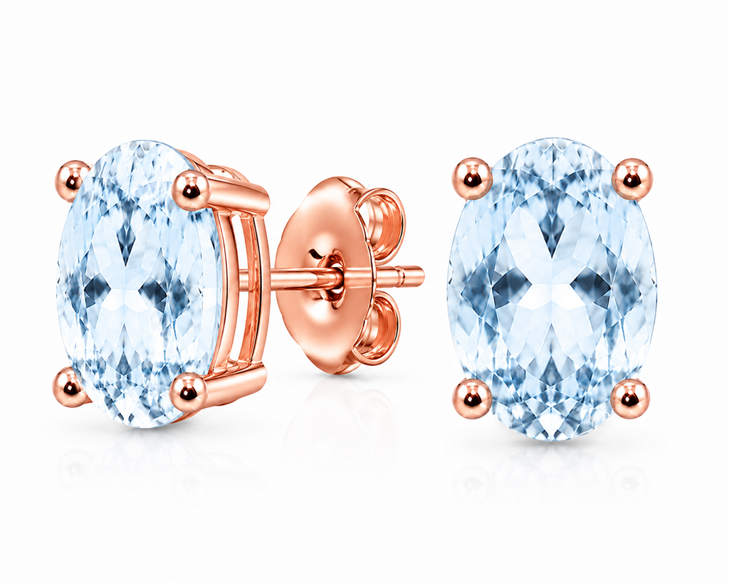 Natural Sky Blue Topaz stud earrings shown at a three-quarter angle with Rose Gold Plated four-prong settings and butterfly backs