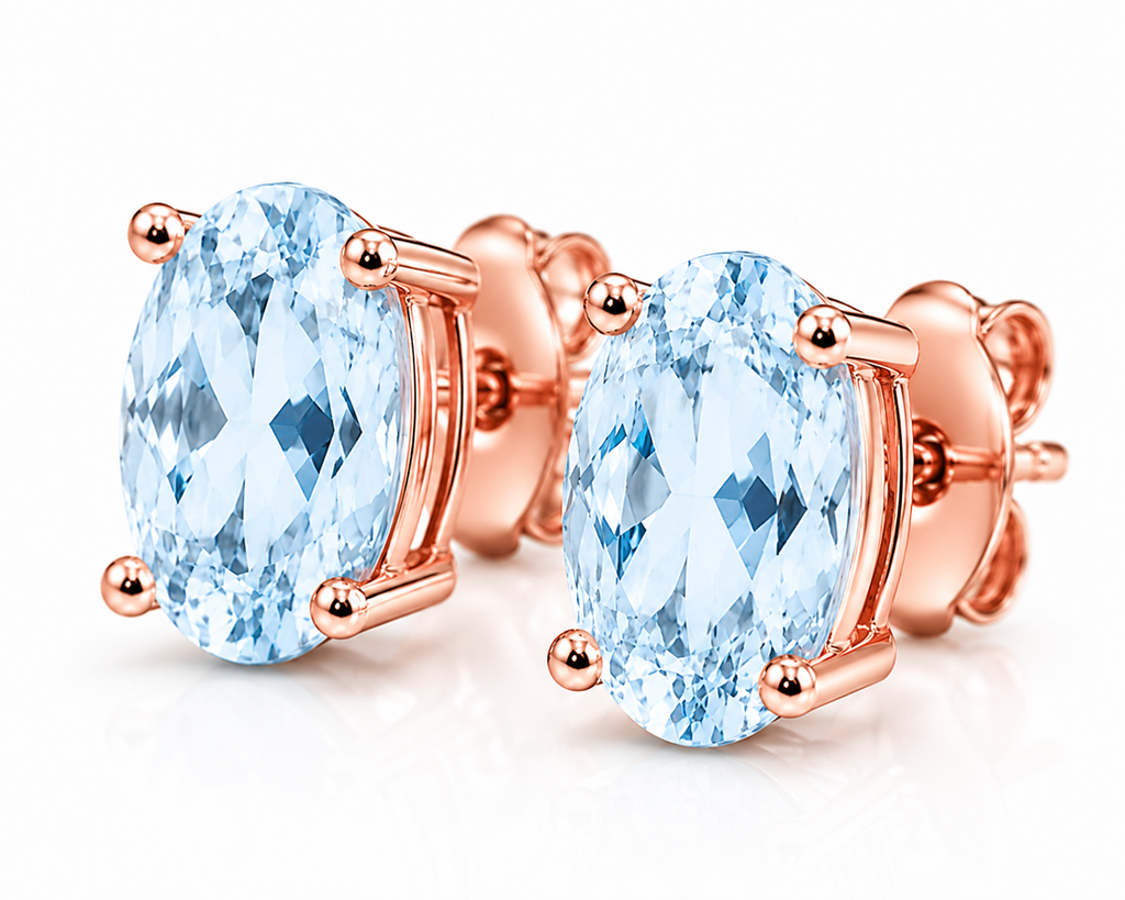 Macro close-up of natural 4x6mm Sky Blue Topaz earrings with pale blue facets and polished Rose Gold Plated settings