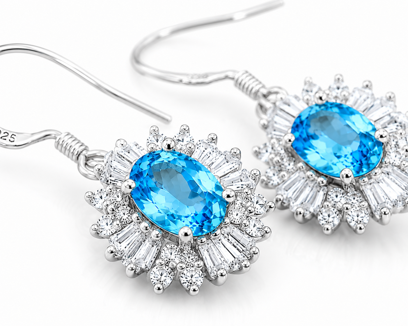 Macro close-up of natural Swiss Blue Topaz floral halo earrings with vivid blue facets and sparkling cubic zirconia accents