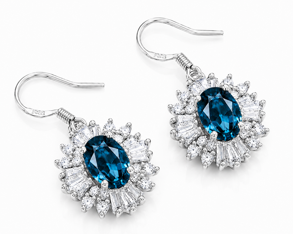 Macro close-up of natural London Blue Topaz floral halo earrings with deep blue facets and sparkling cubic zirconia accents