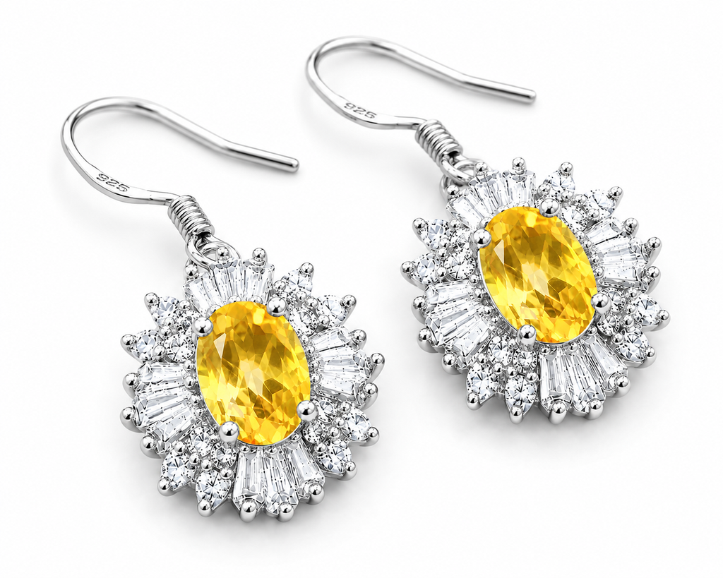 Natural 4x6mm oval citrine halo drop earrings crafted in 925 sterling silver on a pure white background.