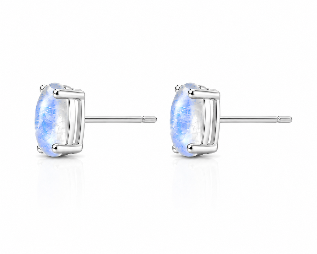 Side profile of moonstone stud earrings showing four-prong basket setting