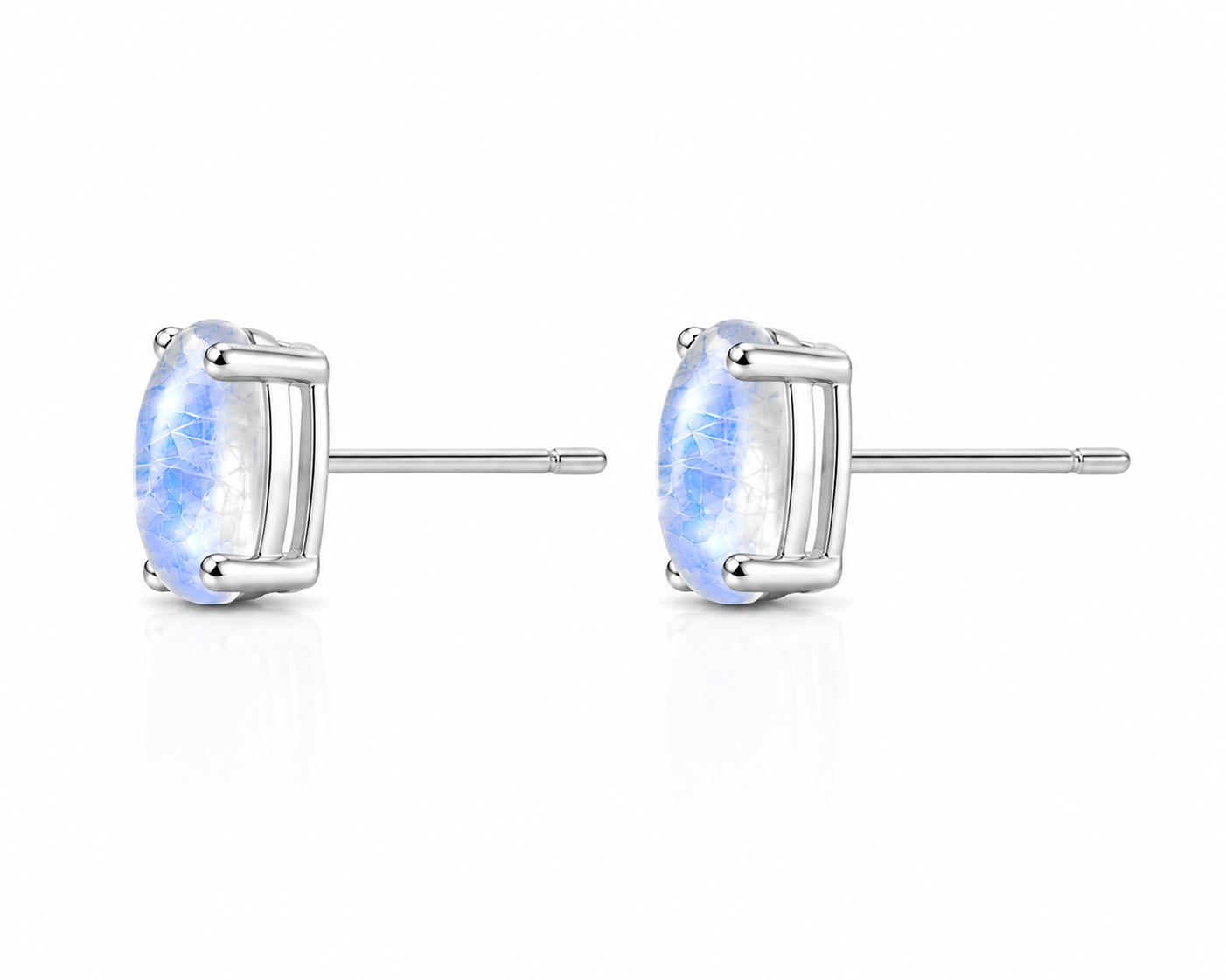 Side profile of moonstone stud earrings showing four-prong basket setting