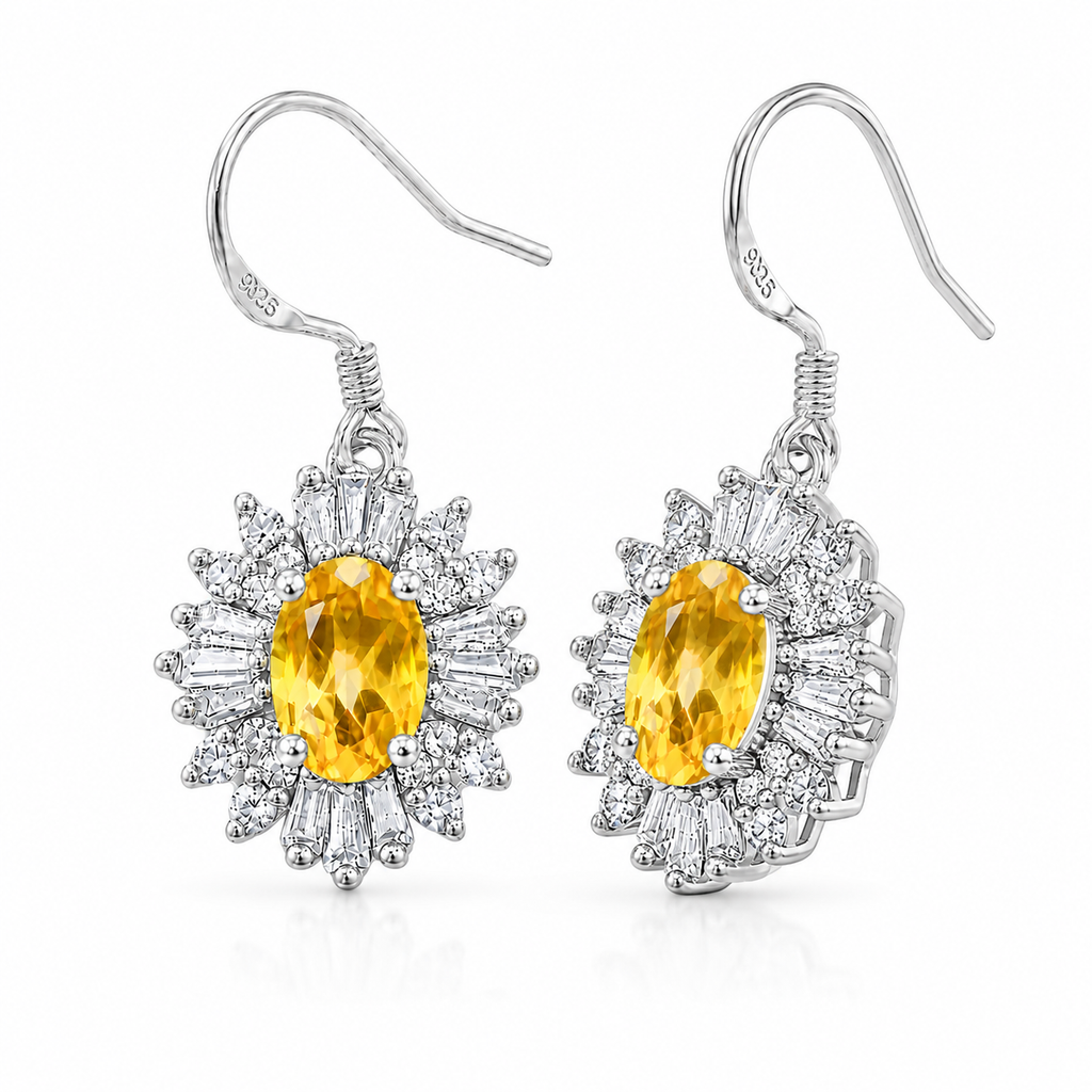 45-degree view of natural citrine halo drop earrings featuring genuine 4x6mm oval citrine gemstones in polished sterling silver.