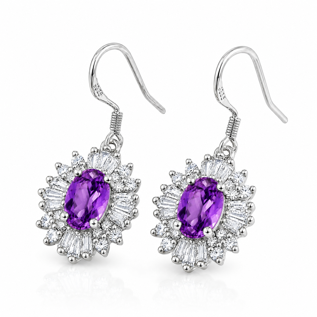 Angled view of purple 4x6mm amethyst drop earrings with floral cubic zirconia halos and sterling silver fishhooks.