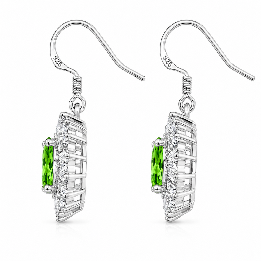 Side profile of natural tsavorite halo earrings showing the raised basket setting, open gallery, and sterling silver craftsmanship.
