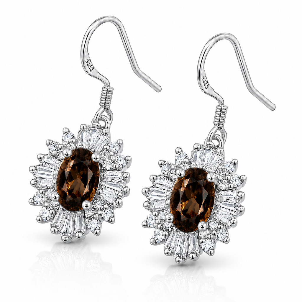 45-degree view of natural smoky quartz halo drop earrings featuring rich brown oval gemstones and polished sterling silver fish hook ear wires.