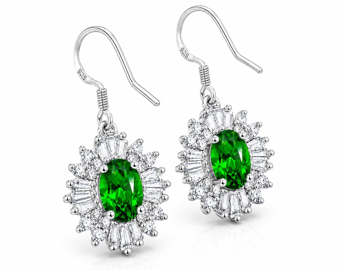 45-degree view of natural chrome diopside halo drop earrings featuring vivid emerald-green oval gemstones in polished sterling silver.