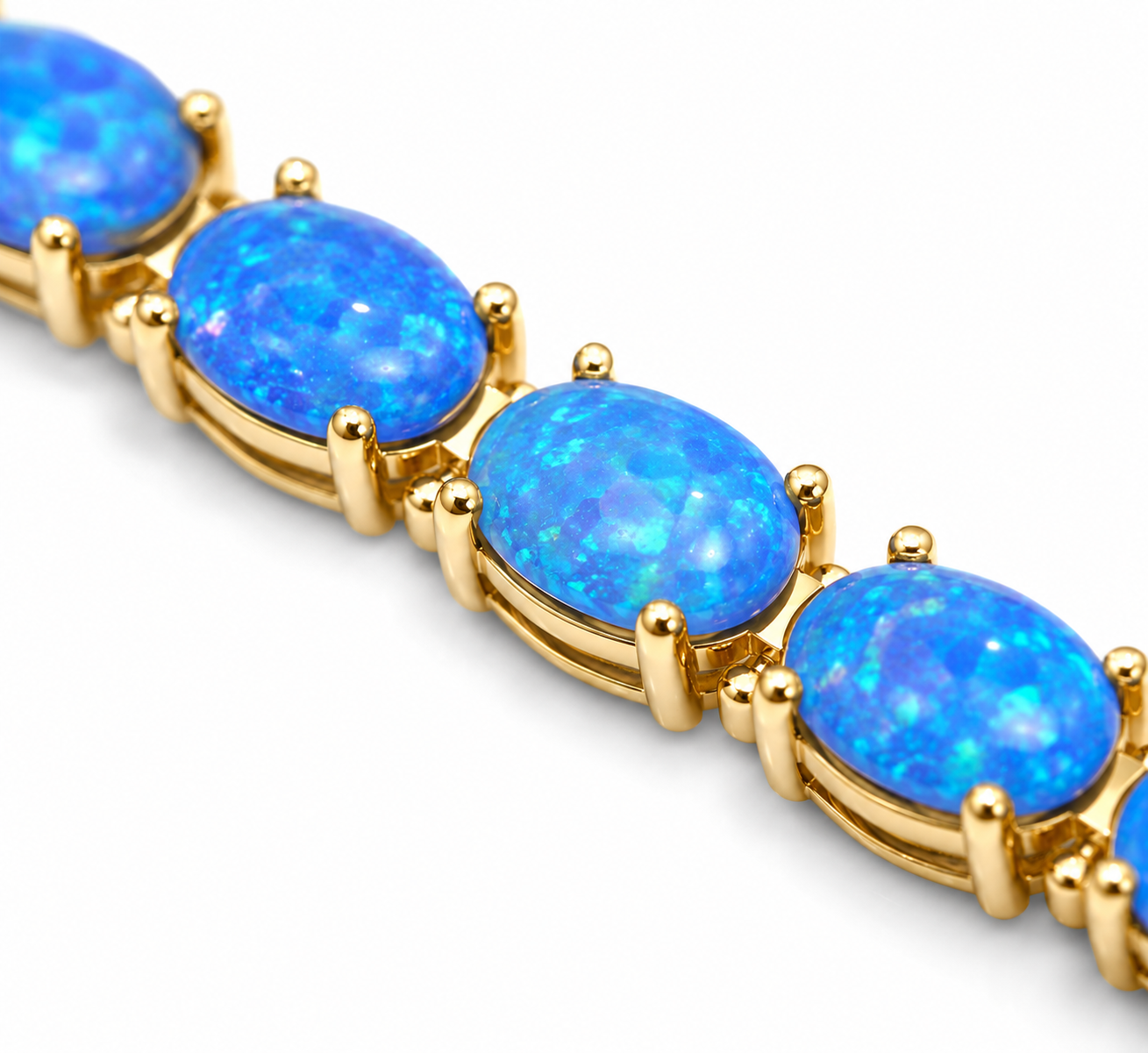Natural Blue Fire Opal bracelet featuring 4x6mm oval Australian Fire Opals in 925 sterling silver with adjustable chain.