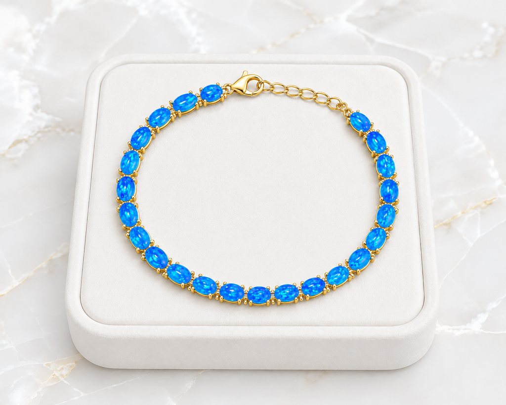 Natural Blue Fire Opal bracelet featuring 4x6mm oval Australian Fire Opals in 925 sterling silver with adjustable chain.