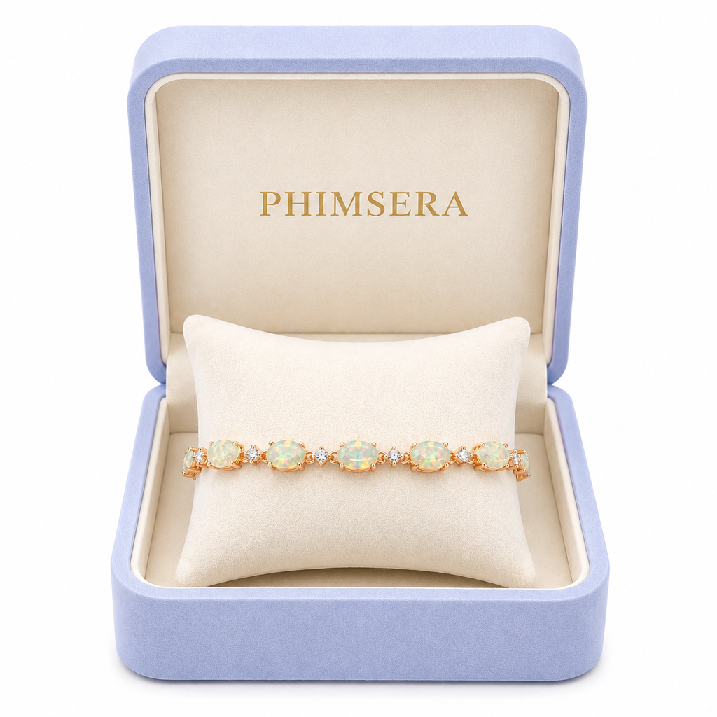 Fire opal bracelet on velvet bracelet pillow in Phimsera box.