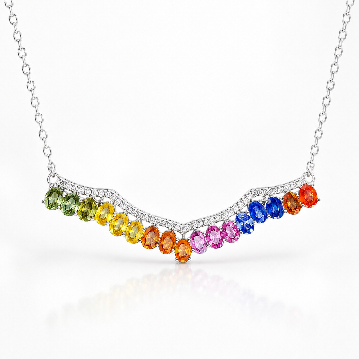 Natural rainbow sapphire necklace featuring colorful 3x4mm oval sapphires in an elegant curved sterling silver design.