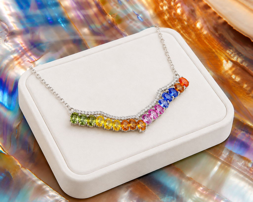 Multicolor sapphire necklace displayed on a luxury white jewelry tray with vibrant natural rainbow gemstones.