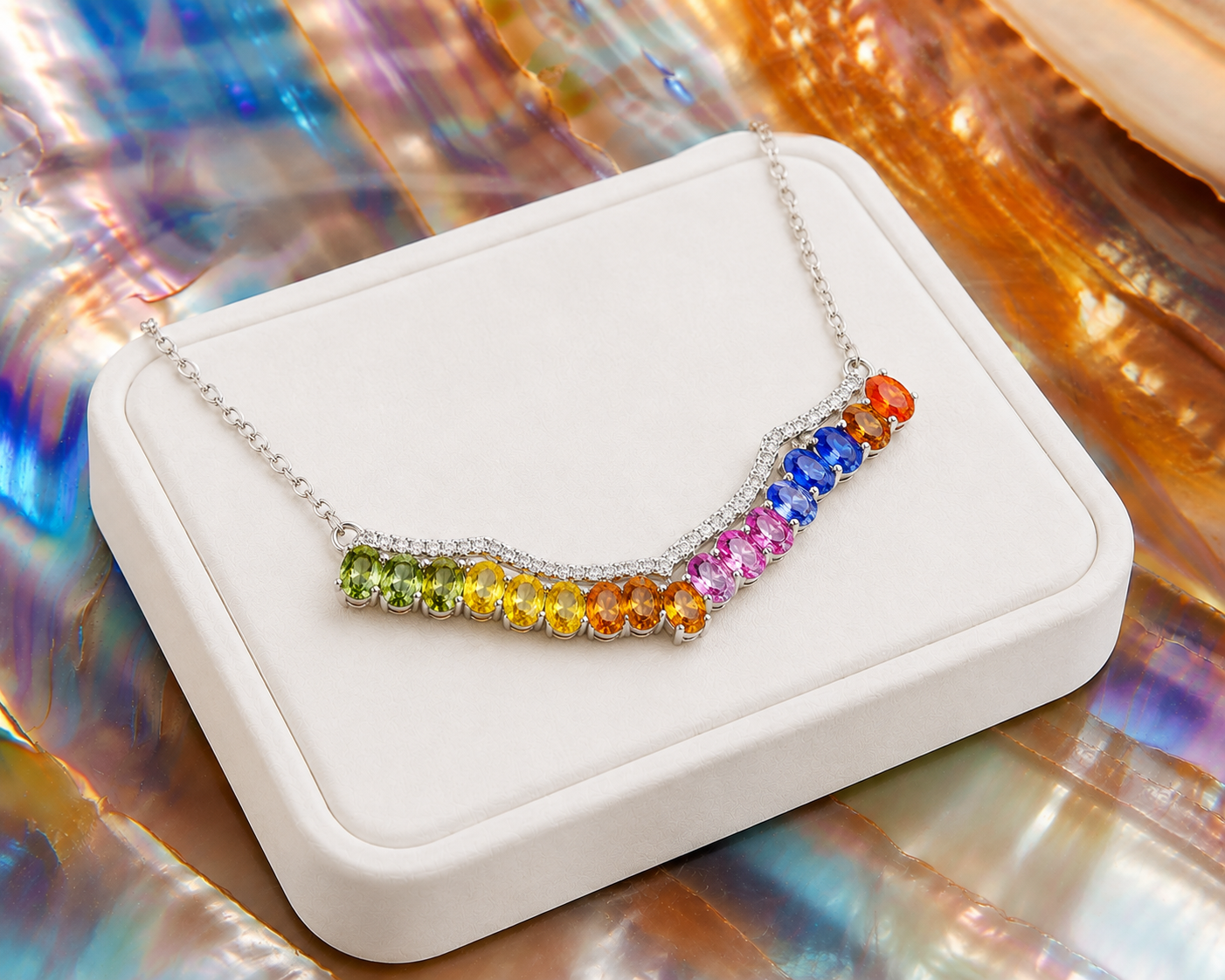 Multicolor sapphire necklace displayed on a luxury white jewelry tray with vibrant natural rainbow gemstones.