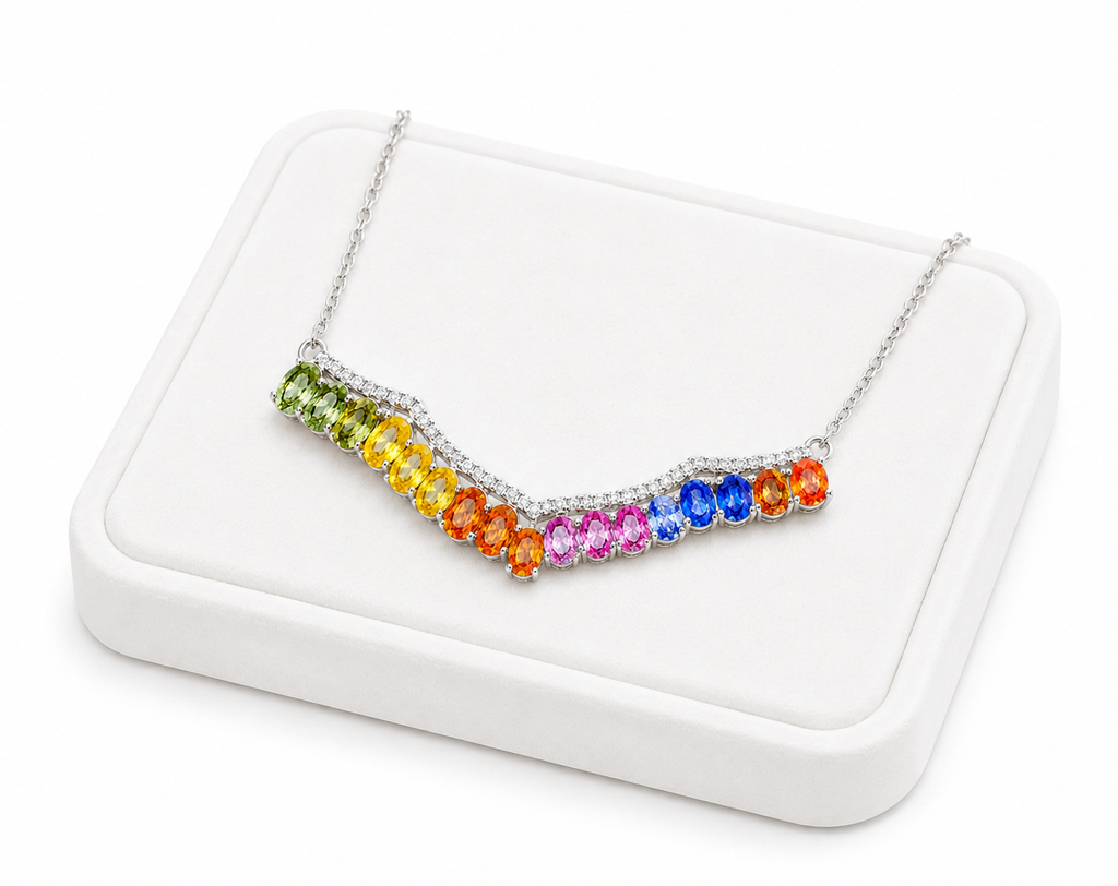 Multicolor sapphire necklace displayed on a luxury white jewelry tray with vibrant natural rainbow gemstones.