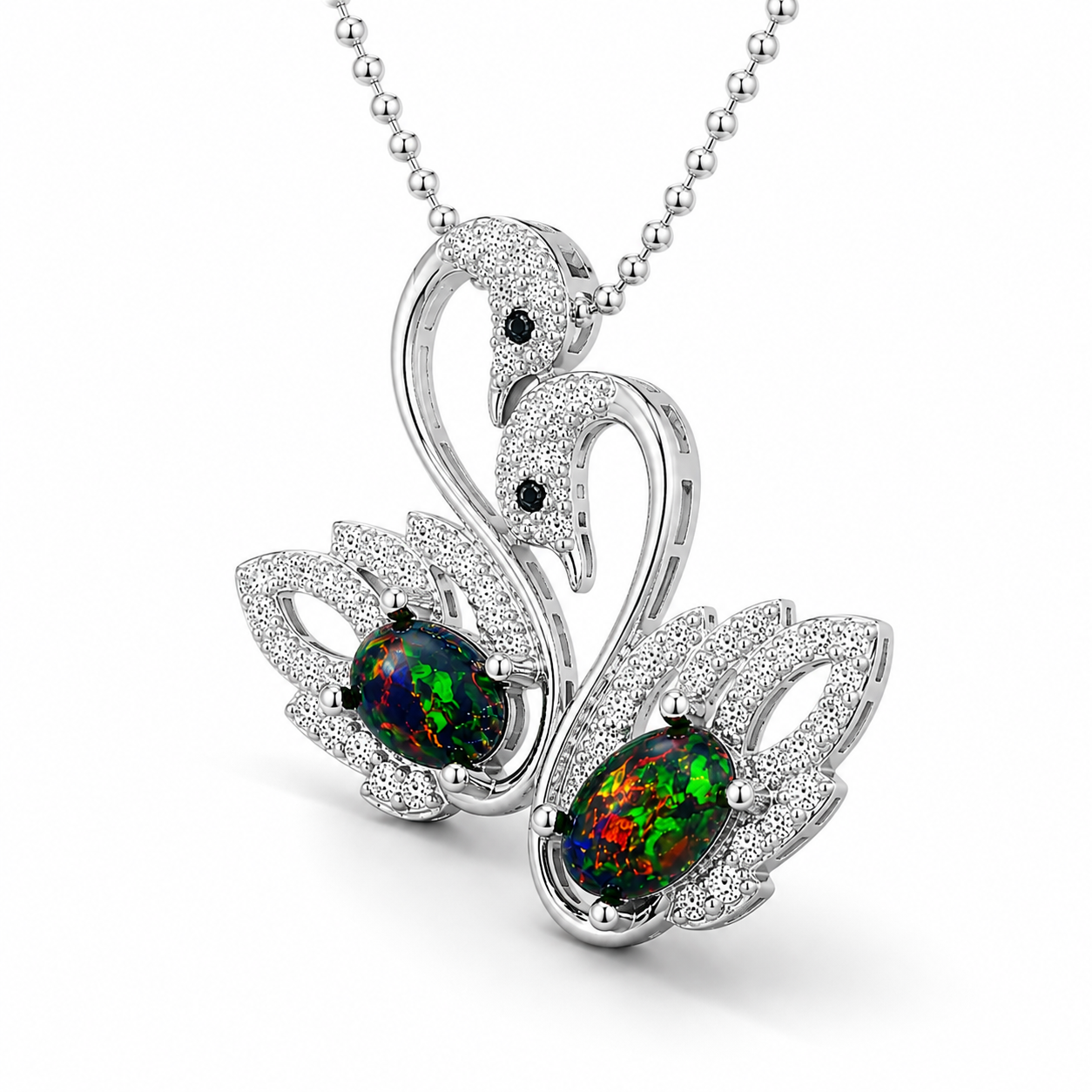 Side view of sterling silver black opal swan pendant showing oval 5x7mm gemstone settings