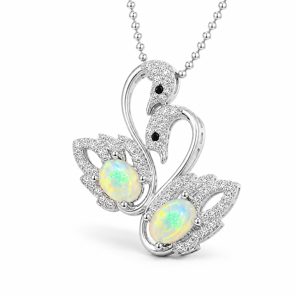 45 degree view of 5x7mm white fire opal swan pendant necklace in sterling silver