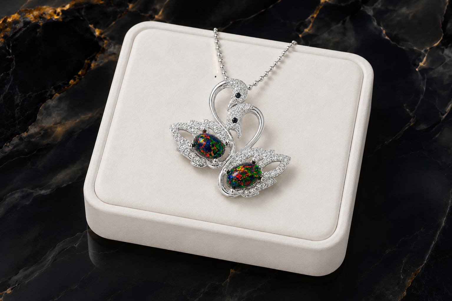 Colorful black fire opal double swan necklace with two 5x7mm oval Australian opals in sterling silver