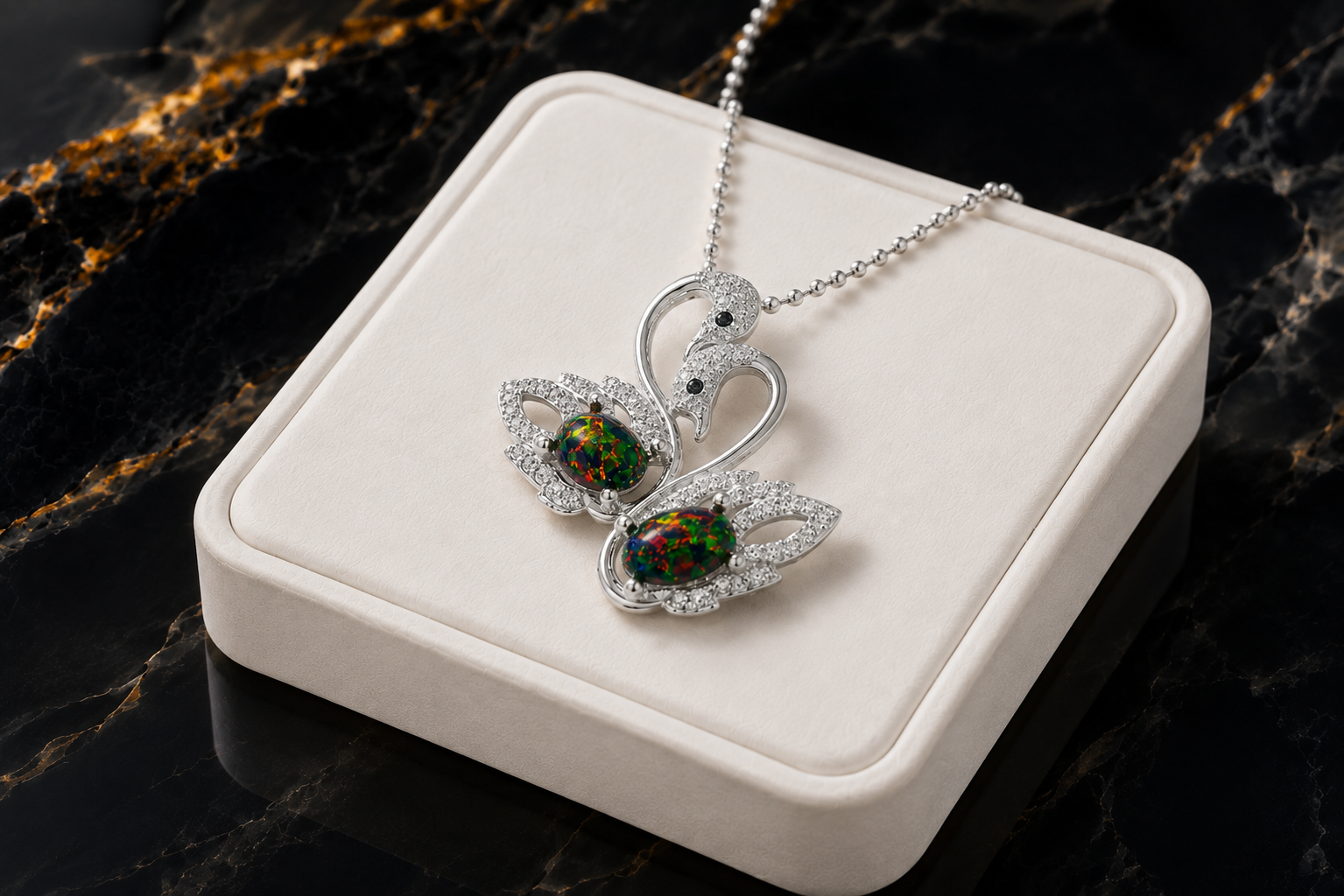 Colorful black fire opal double swan necklace with two 5x7mm oval Australian opals in sterling silver
