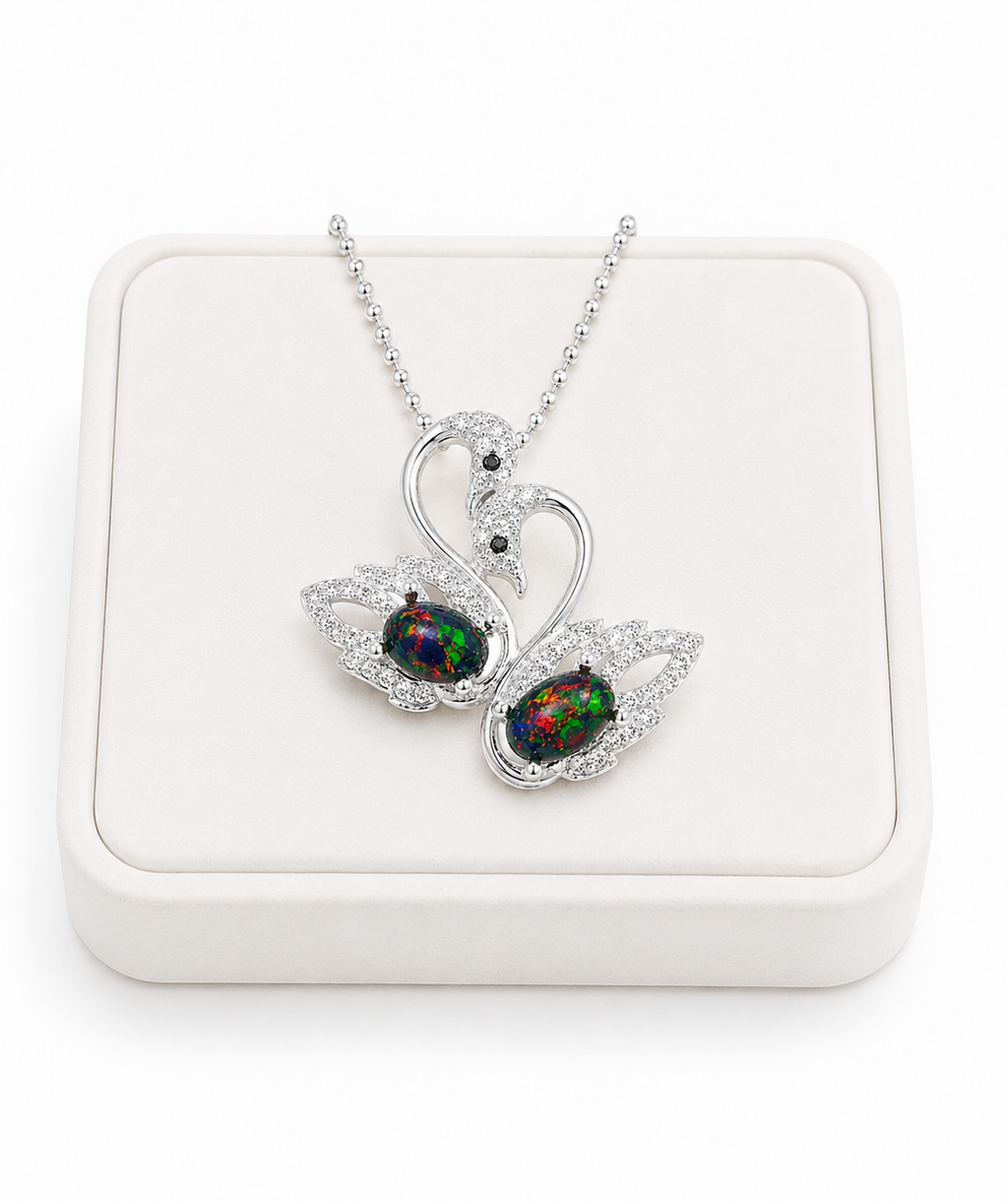 Colorful black fire opal double swan necklace with two 5x7mm oval Australian opals in sterling silver