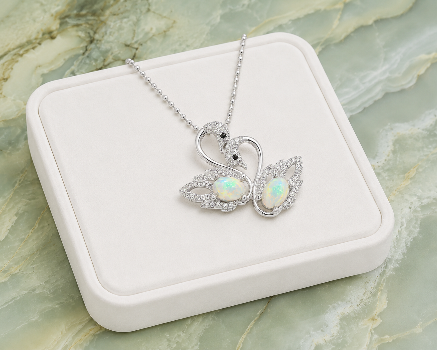 White fire opal double swan necklace with two 5x7mm oval opals in 925 sterling silver