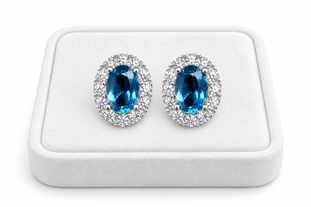 London Blue Topaz 4x6mm stud earrings displayed on a white luxury jewelry tray