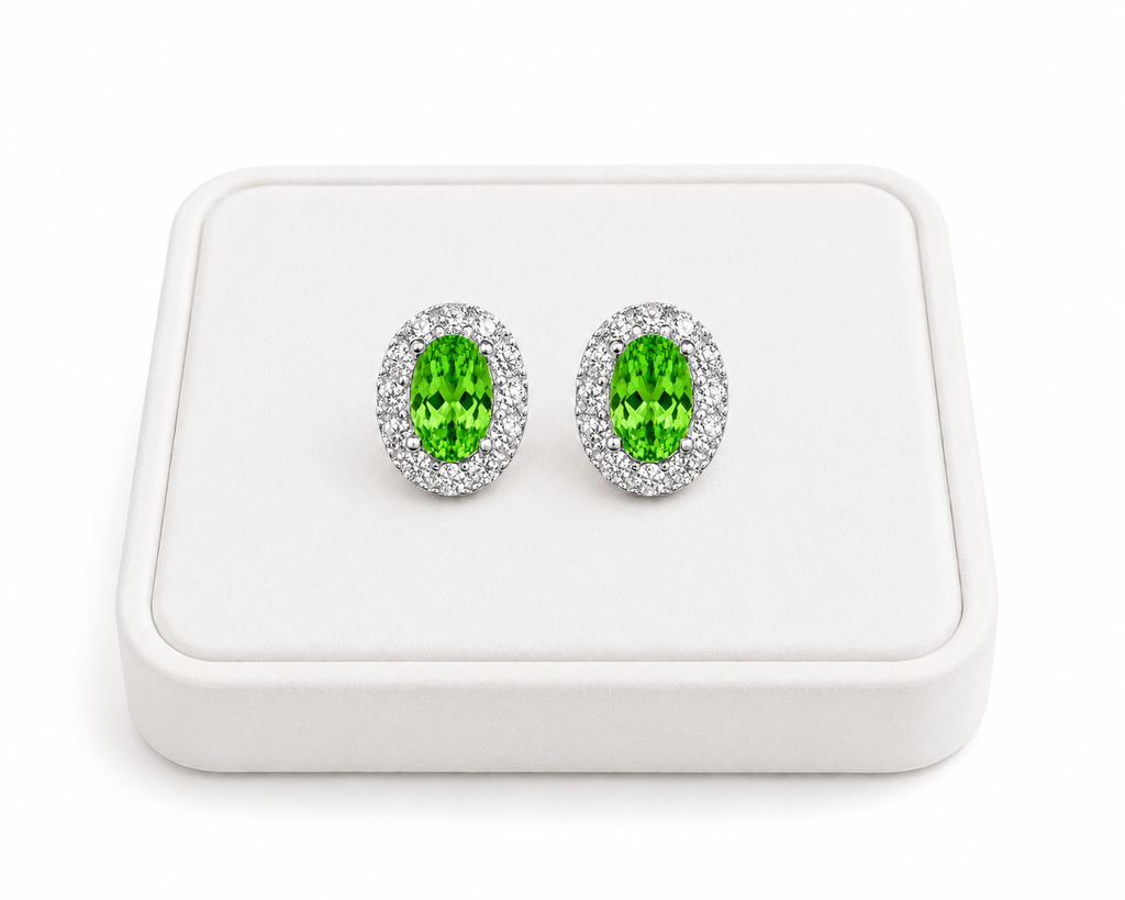 Natural 4x6mm green tsavorite halo earrings displayed on a white jewelry tray