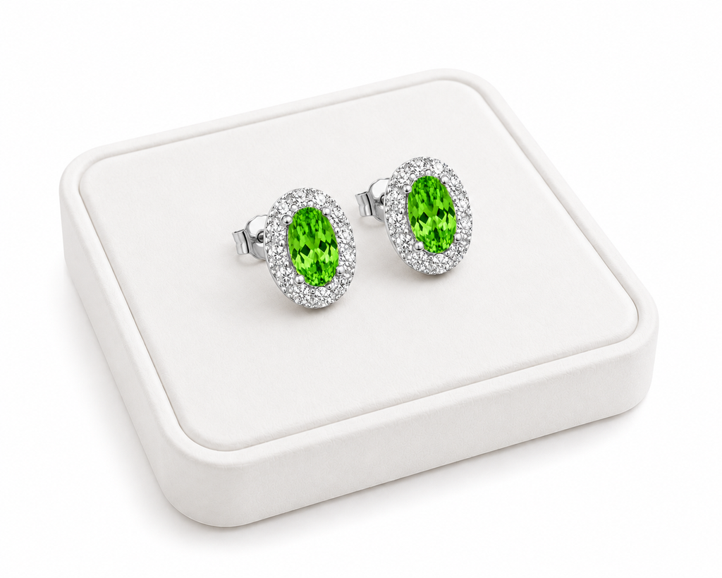 Natural 4x6mm green tsavorite halo earrings displayed on a white jewelry tray