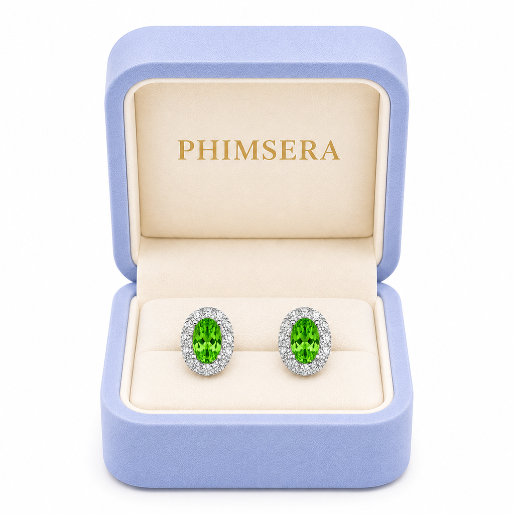 4x6mm natural green tsavorite halo stud earrings displayed in a Phimsera jewelry gift box