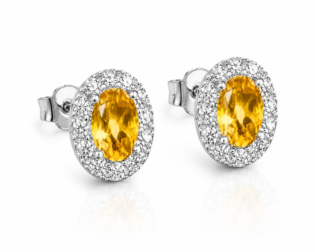 Natural citrine 4x6mm oval halo earrings shown at a 45 degree angle