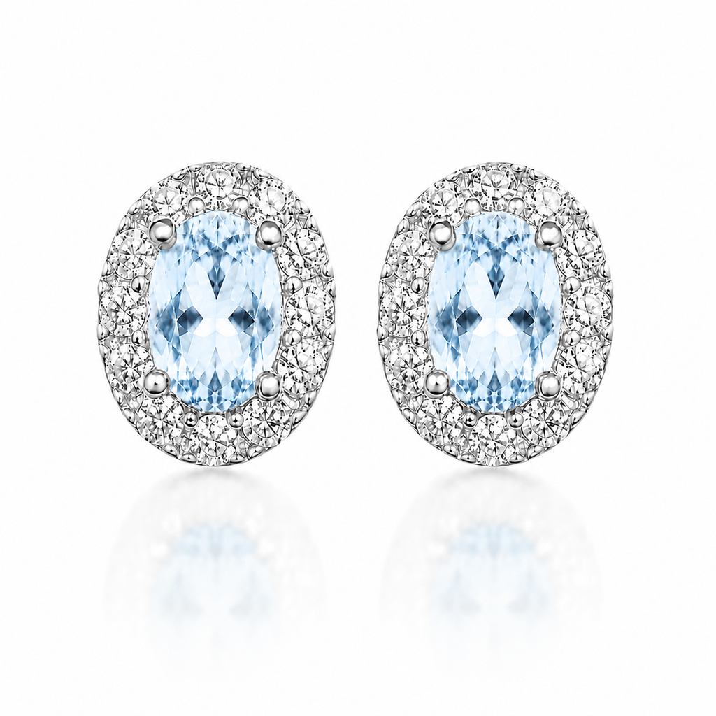 Natural 4x6mm Sky Blue Topaz oval halo stud earrings in 925 sterling silver front view