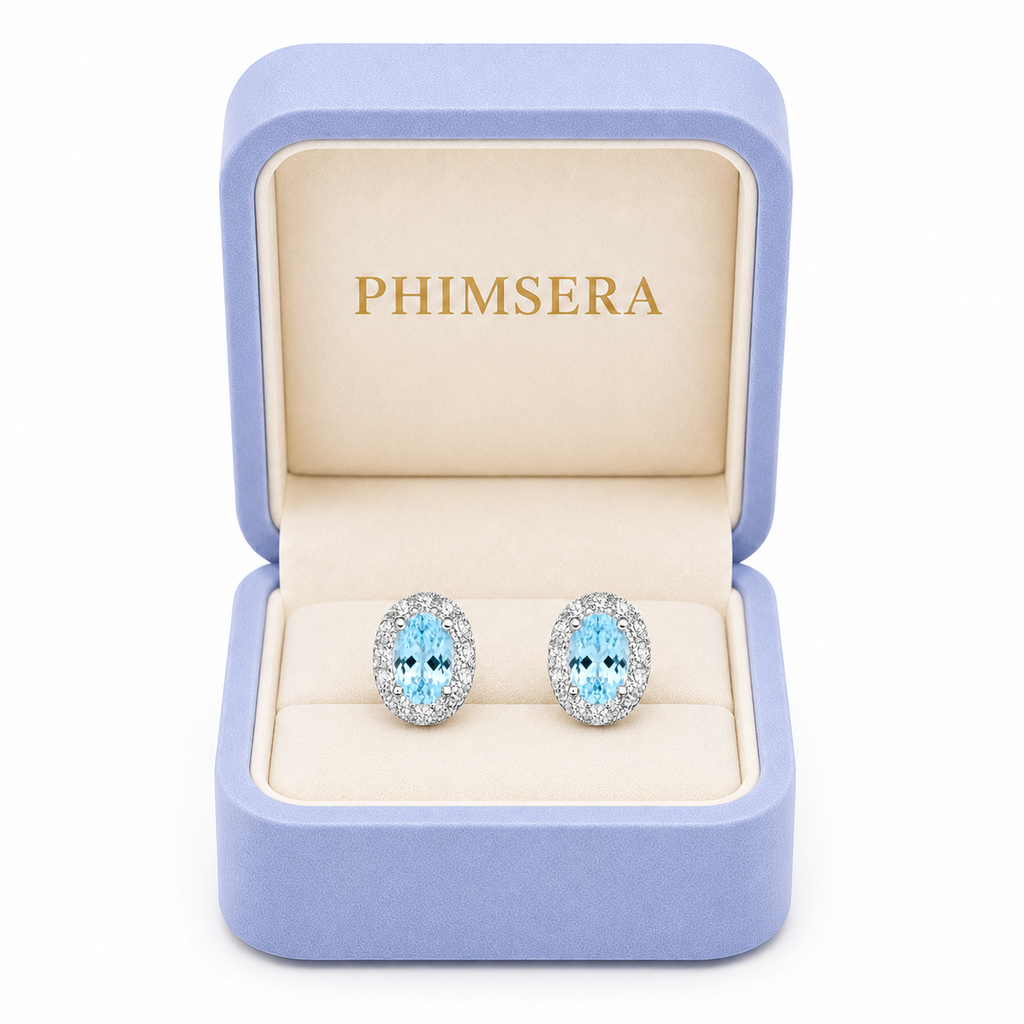 Natural aquamarine stud earrings presented in a Phimsera jewelry gift box