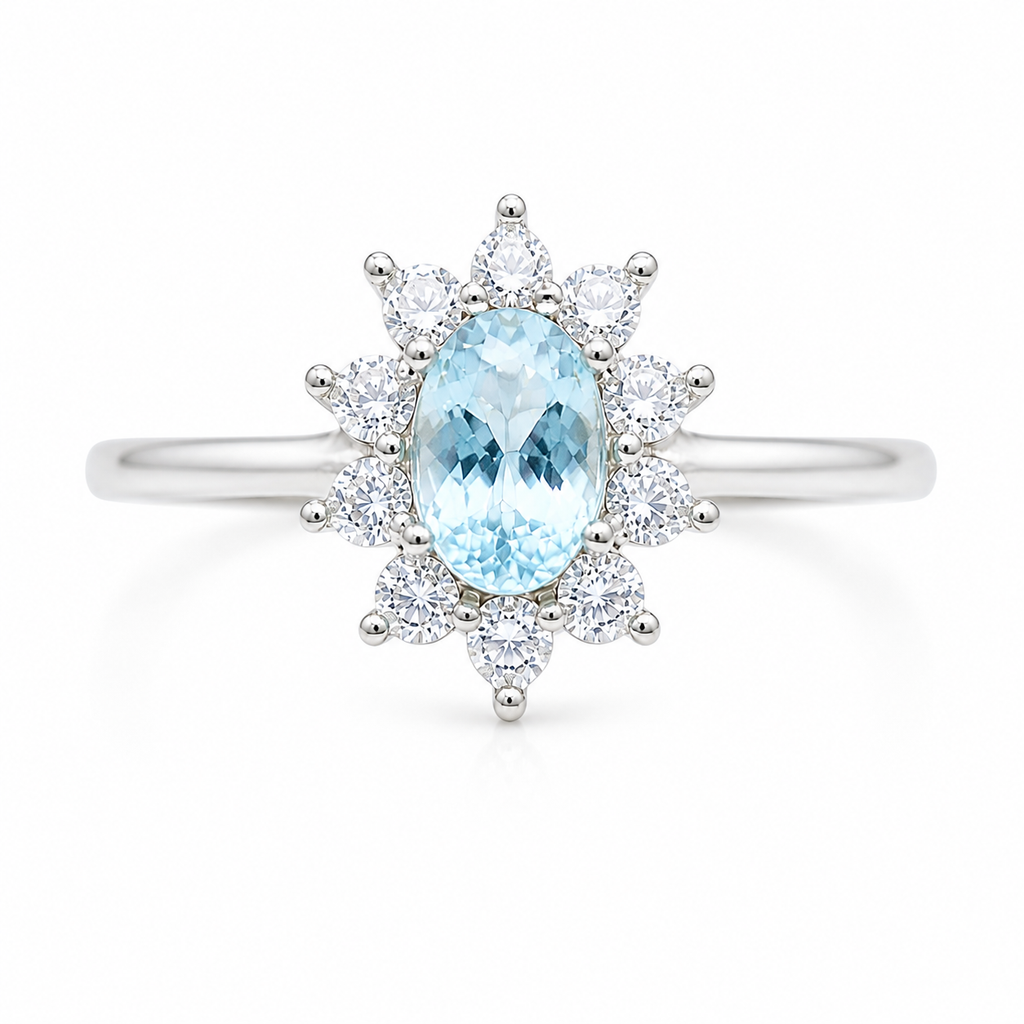 Top view of natural 4x6mm aquamarine ring with floral sunburst CZ halo