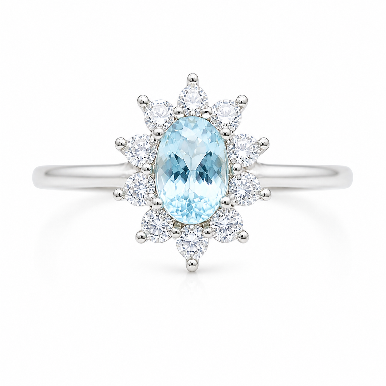 Top view of natural 4x6mm aquamarine ring with floral sunburst CZ halo