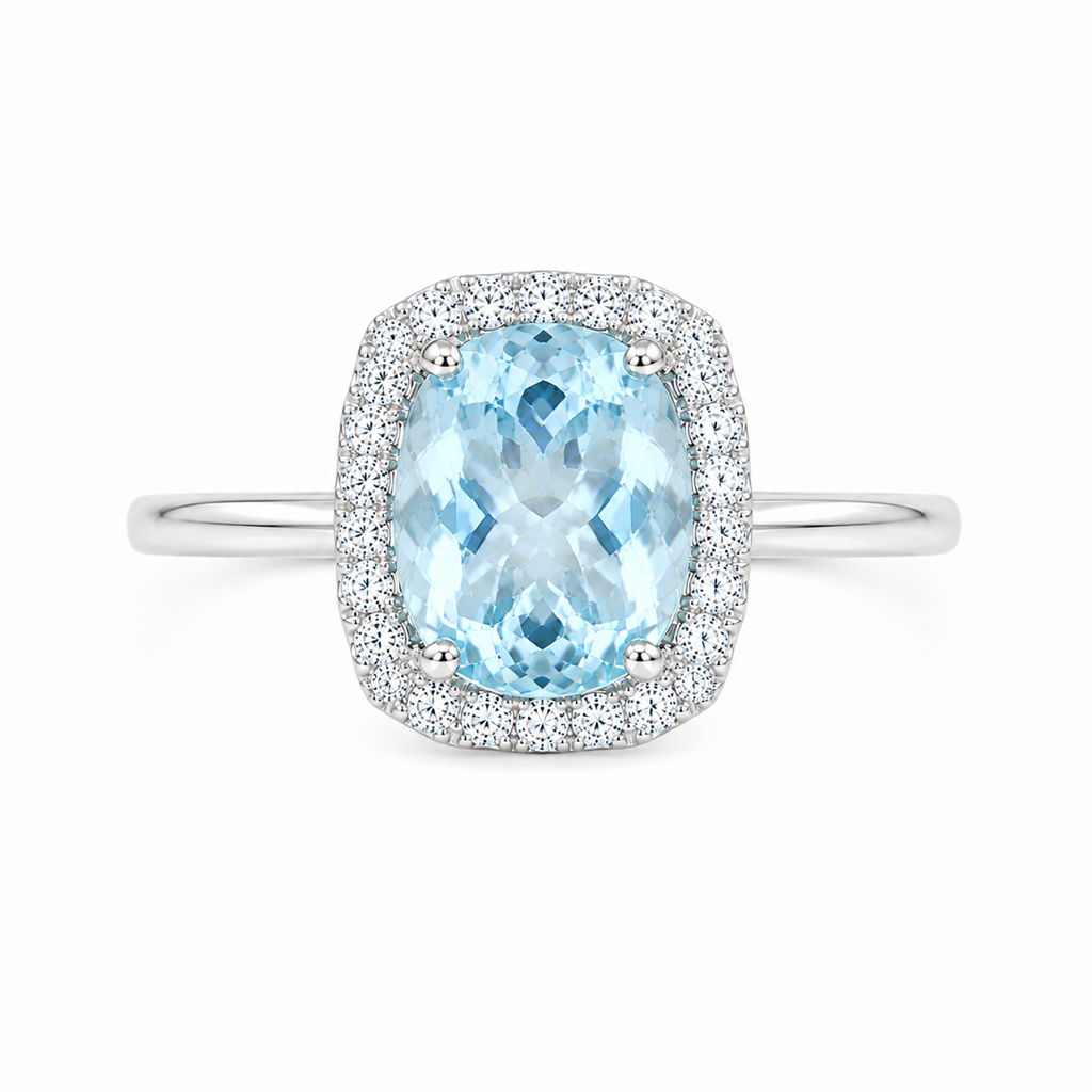 Top view of natural aquamarine halo ring with sparkling cubic zirconia accents