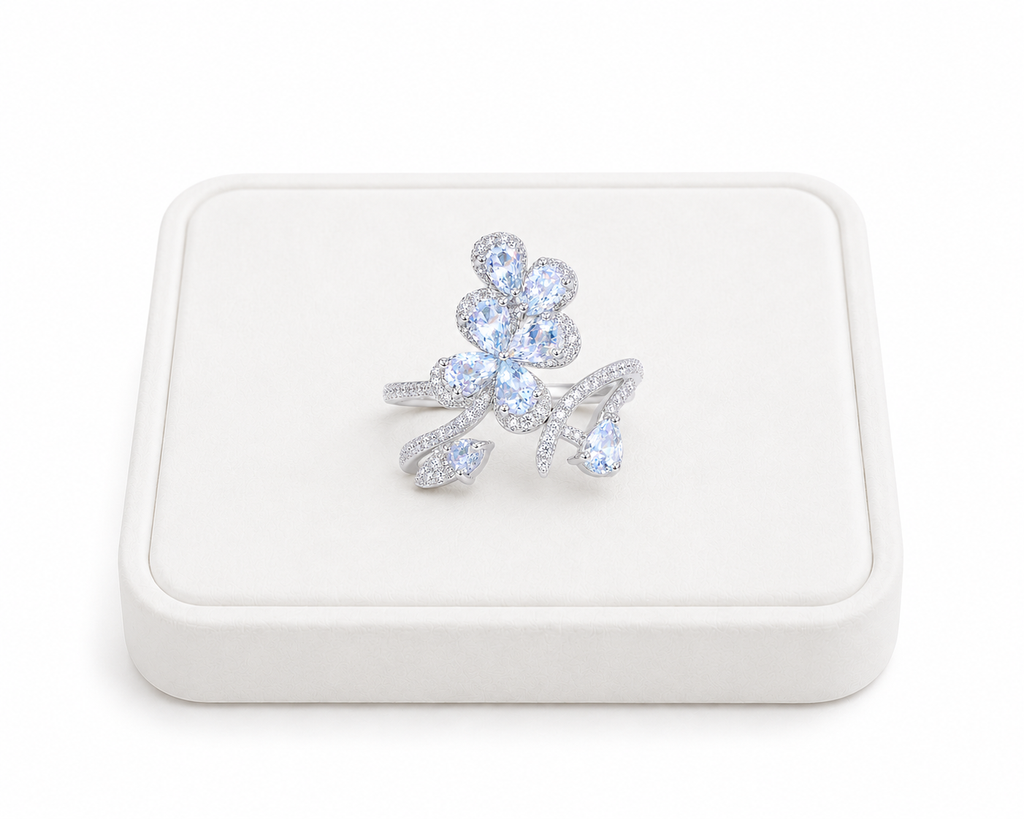 Natural aquamarine floral ring with 3x4mm pear-cut gemstones in sterling silver