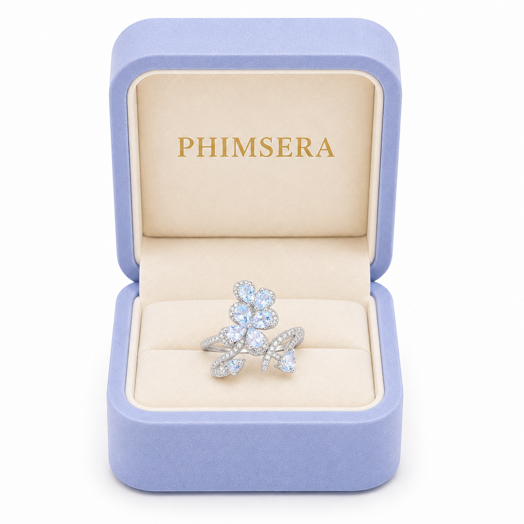 Natural aquamarine floral ring with 3x4mm pear-cut gemstones in sterling silver