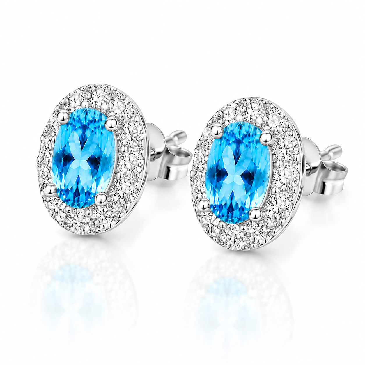 Close-up of 4x6mm Swiss Blue Topaz oval gemstones with sparkling CZ halo