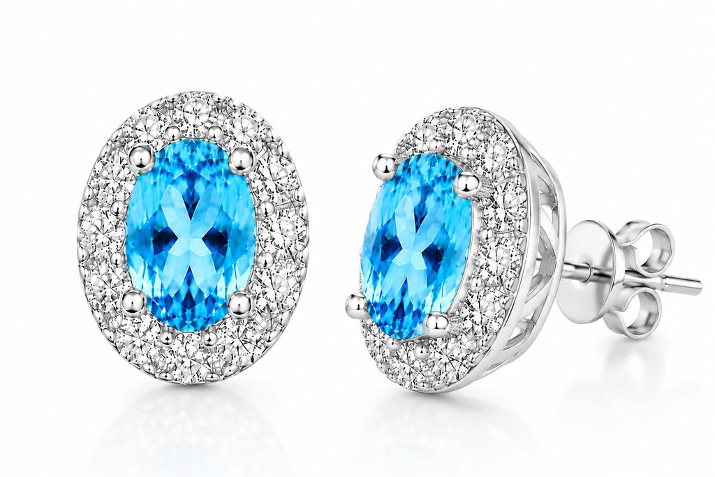 4x6mm Swiss Blue Topaz oval halo stud earrings shown at 45 degree angle
