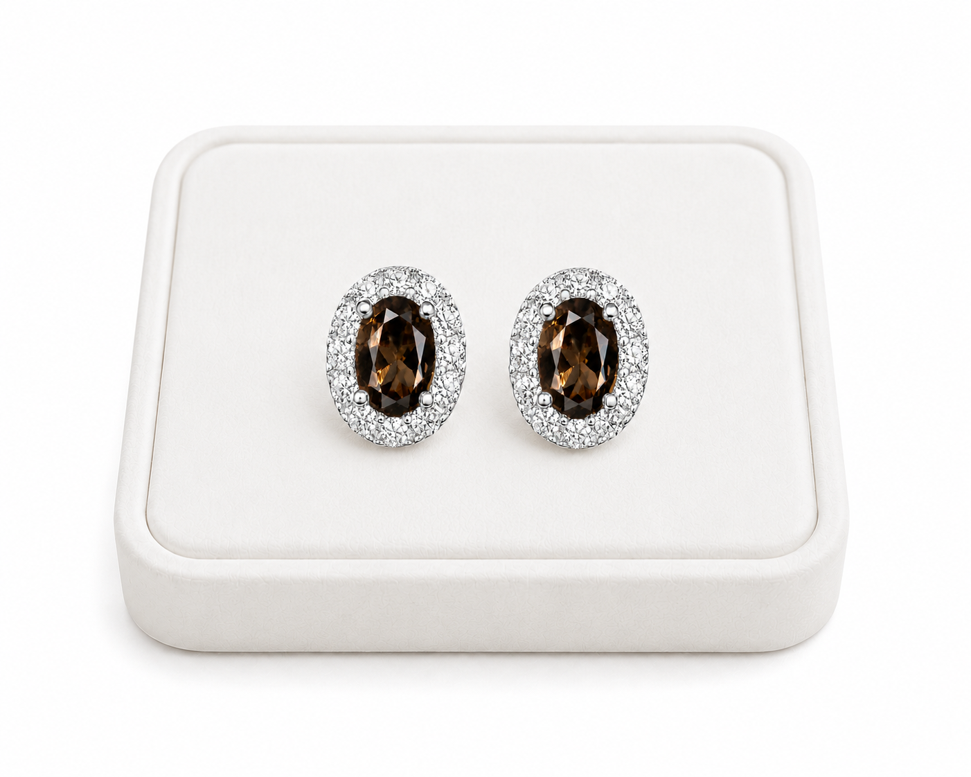 Natural 4x6mm smoky quartz halo stud earrings displayed on white jewelry tray