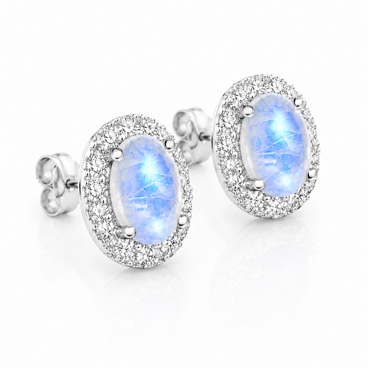 Blue Moonstone 4x6mm oval halo earrings shown at a 45 degree angle