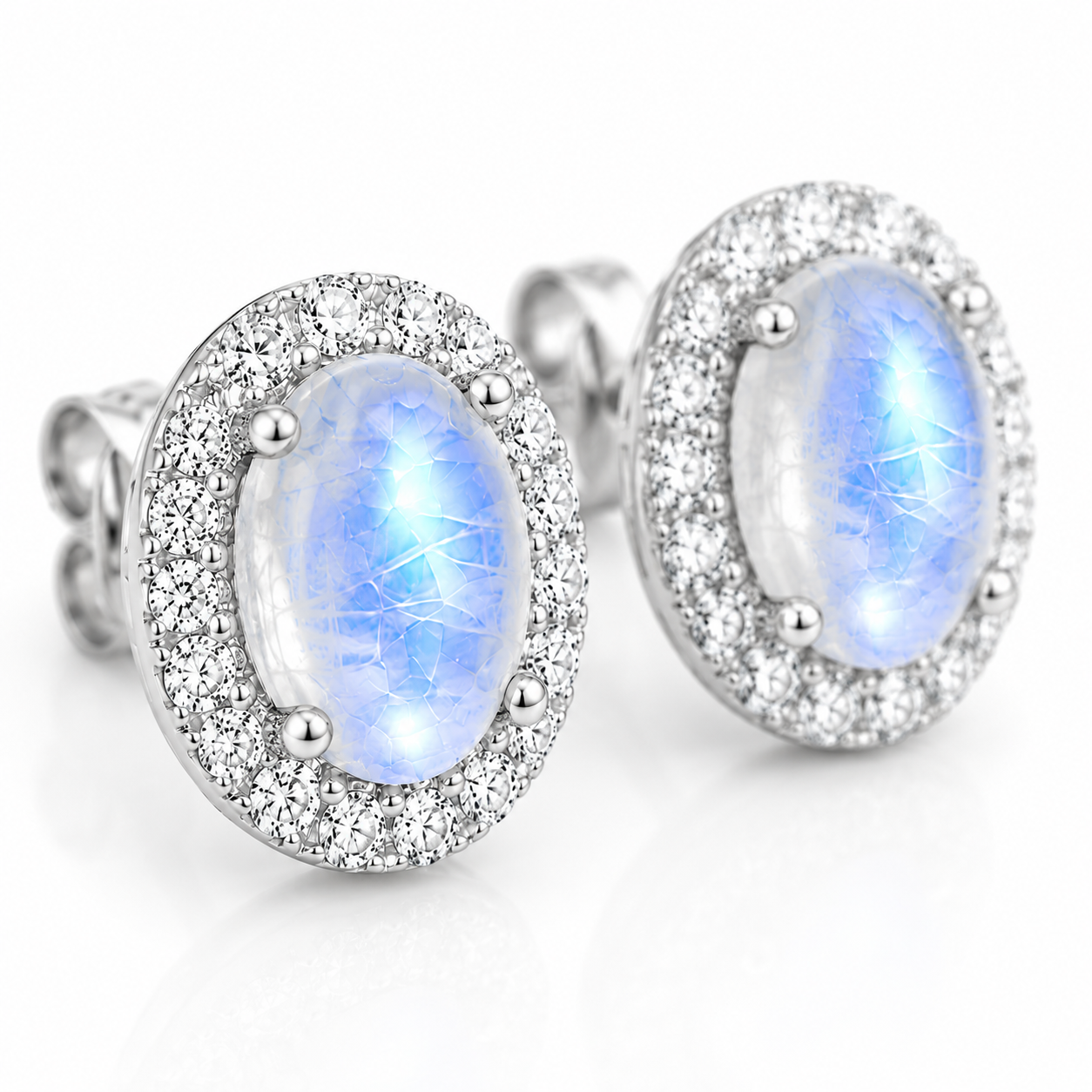 Macro close-up of natural Blue Moonstone earrings showing blue sheen and halo details