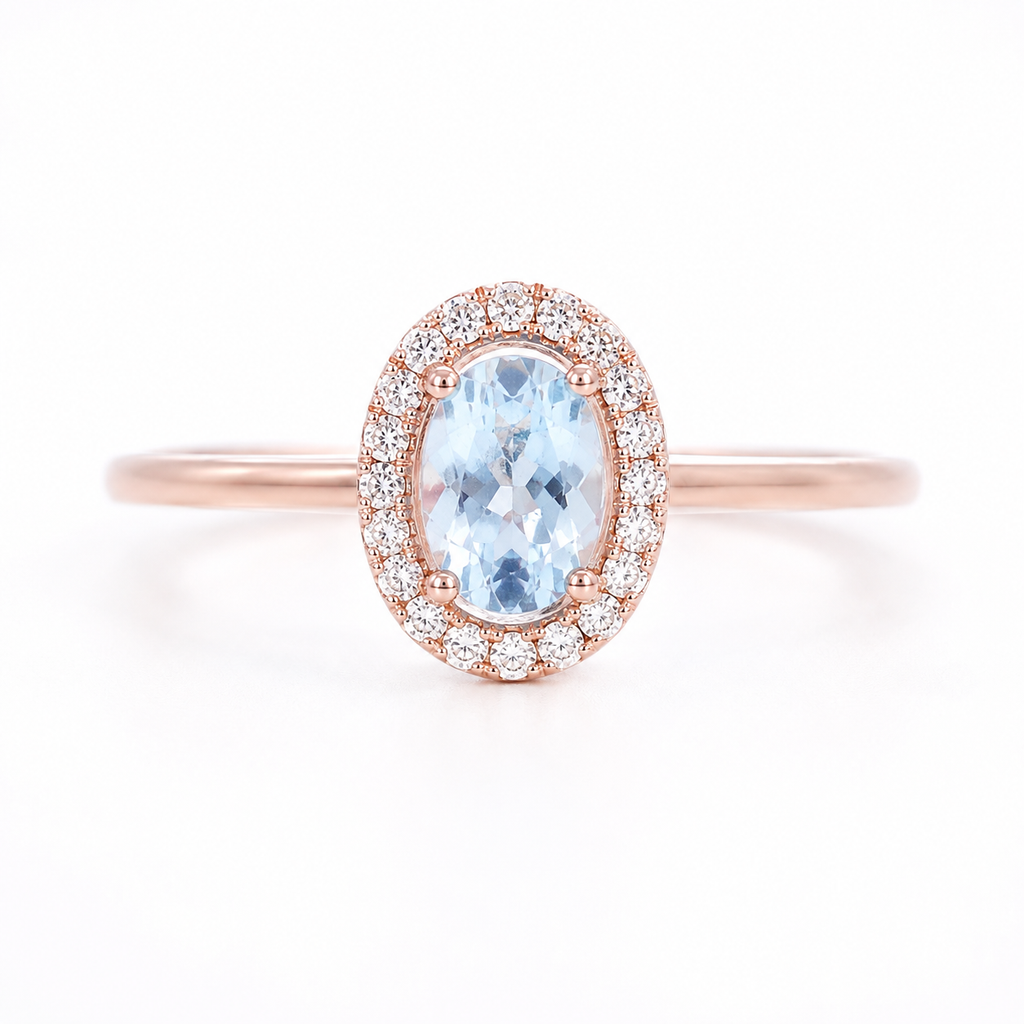Natural 4x6mm oval aquamarine halo ring with cubic zirconia accents in sterling silver